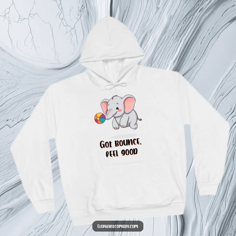 Funny chubby elephant hoodie showing a cute elephant character happily bouncing a colorful ball with its trunk, full of playful energy.